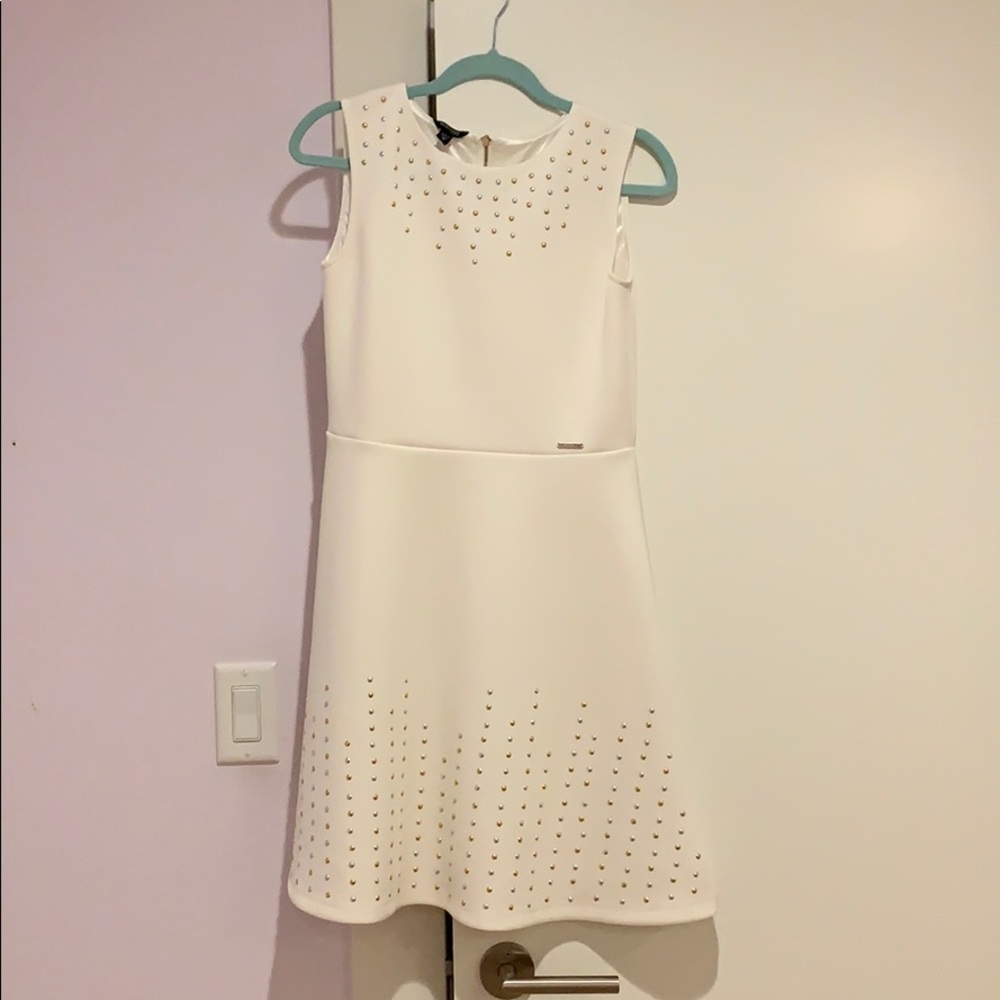 White dress with gold and silver accents
